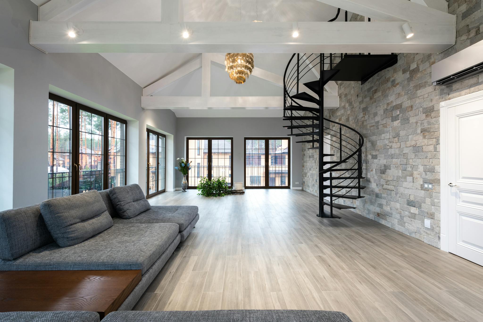 contemporary living room with curvy black stairs